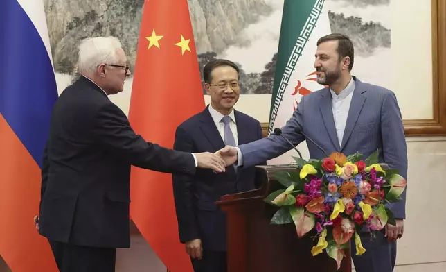 FILE - Russian Deputy Foreign Minister Sergei Ryabkov, from left, Chinese Vice Foreign Minister Ma Zhaoxu and Iranian Deputy Foreign Minister Kazem Gharibabadi, meet with reporters after their meeting at Diaoyutai State Guest House March 14, 2025, in Beijing. (Lintao Zhang/Pool Photo via AP, File)