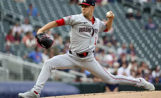 Washington Nationals pitcher MacKenzie Gore delivers a pitch to the Minnesota Twins during the first inning of a baseball game Friday, July 25, 2025, in Minneapolis. (AP Photo/Ellen Schmidt)