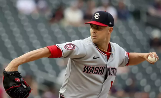 Washington Nationals pitcher MacKenzie Gore delivers a pitch to the Minnesota Twins during the first inning of a baseball game Friday, July 25, 2025, in Minneapolis. (AP Photo/Ellen Schmidt)