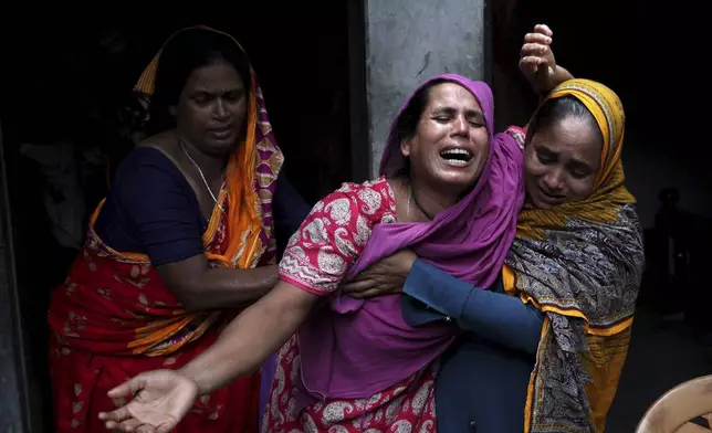 A woman mourns the death of her son who died during the previous day's violent clashes between supporters of ousted Prime Minister Sheikh Hasina and security forces in Gopalganj, Bangladesh, Thursday, July 17, 2025. (AP Photo/Abdul Goni)