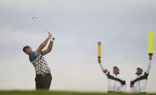 Viktor Hovland of Norway plays his tee shot on the 6th hole during the first round of the British Open golf championship at the Royal Portrush Golf Club, Northern Ireland, Thursday, July 17, 2025. (AP Photo/Francisco Seco)