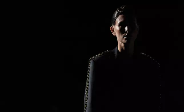 A model wears a creation by designer Alejandro Crocker at the Bogota Planetarium in Bogotá, Colombia, Wednesday, July 16, 2025. (AP Photo/Ivan Valencia)