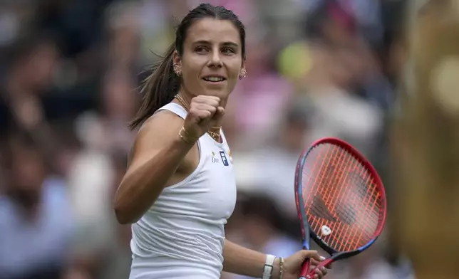Emma Navarro of the U.S. celebrates winning the women's singles third round match against Barbora Krejcikova of Czech Republic at the Wimbledon Tennis Championships in London, Saturday, July 5, 2025.(AP Photo/Alastair Grant)