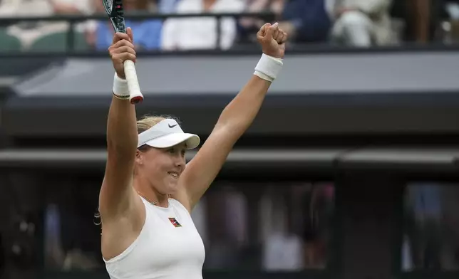 Mirra Andreeva of Russia celebrates winning the women's singles third round match against Hailey Baptiste of the U.S. at the Wimbledon Tennis Championships in London, Saturday, July 5, 2025.(AP Photo/Alastair Grant)