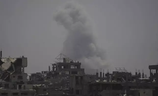 Smoke rises following an Israeli airstrike in northern Gaza Strip, Tuesday, July 29, 2025. (AP Photo/Jehad Alshrafi)