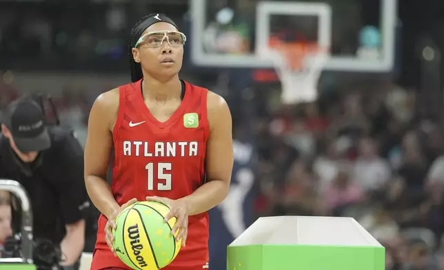 Atlanta Dream's Allisha Gray shoots during the 3-point contest at the WNBA All-Star basketball weekend, Friday, July 18, 2025, in Indianapolis. (AP Photo/Michael Conroy)