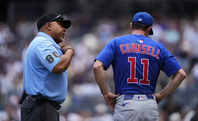 Chicago Cubs manager Craig Counsell (11) speaks with umpire Adrian Johnson (80) during the third inning of a baseball game against the New York Yankees, Saturday, July 12, 2025, in New York. (AP Photo/Yuki Iwamura)