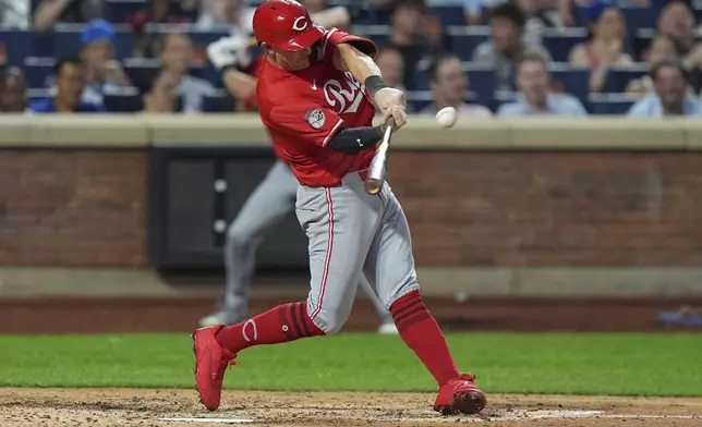 Cincinnati Reds' Austin Hays hits a home run during the sixth inning of a baseball game against the New York Mets Friday, July 18, 2025, in New York. (AP Photo/Frank Franklin II)