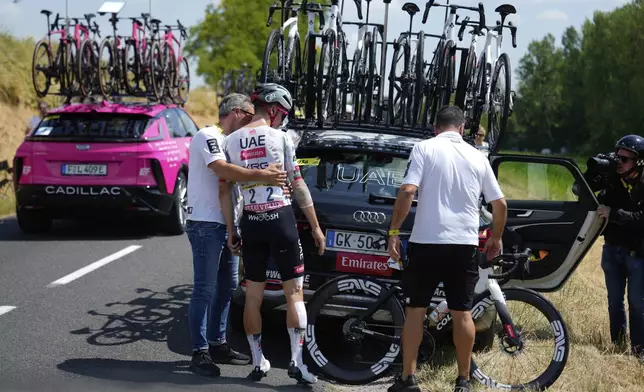 Portugal's Joao Almeida retires from the race during the ninth stage of the Tour de France cycling race over 174.1 kilometers (108 miles) with start in Chinon and finish in Chateauroux, France, Sunday, July 13, 2025. (AP Photo/Mosa'ab Elshamy)