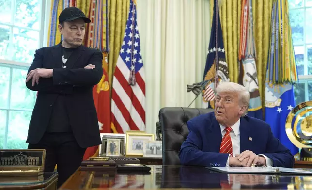 FILE - President Donald Trump, right, speaks during a news conference with Elon Musk in the Oval Office of the White House, in Washington, May 30, 2025,. (AP Photo/Evan Vucci, File)