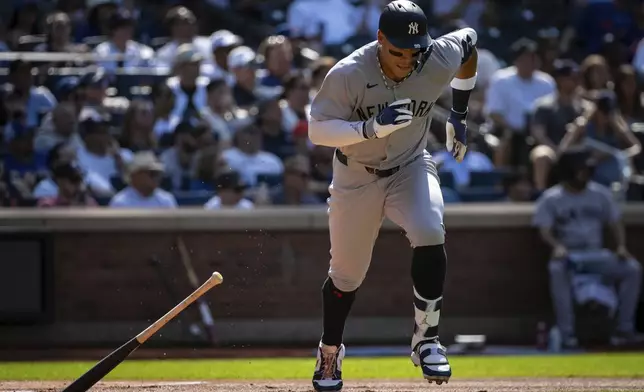 New York Yankees' Aaron Judge drops his bat after hitting a single during the first inning of a baseball game against the New York Mets, Saturday, July 5, 2025, in New York. (AP Photo/Angelina Katsanis)