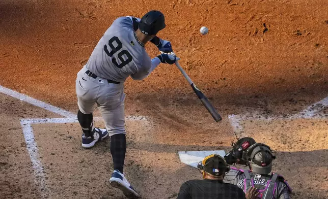 New York Yankees' Aaron Judge bats during the sixth inning of a baseball game against the New York Mets, Saturday, July 5, 2025, in New York. (AP Photo/Angelina Katsanis)