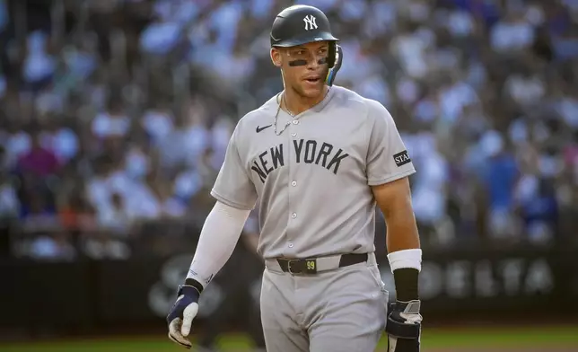New York Yankees' Aaron Judge leaves the field after not scoring in the eighth inning of a baseball game against the New York Mets, Saturday, July 5, 2025, in New York. (AP Photo/Angelina Katsanis)