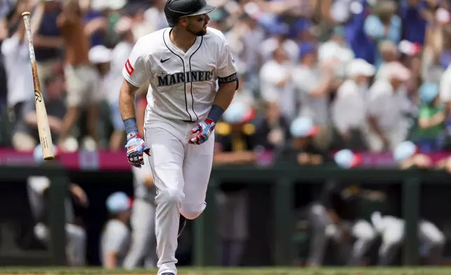 Seattle Mariners designated hitter Cal Raleigh tosses his bat after hitting a two-run home run during the first inning of a baseball game against the Pittsburgh Pirates, Friday, July 4, 2025, in Seattle. (AP Photo/Ryan Sun)
