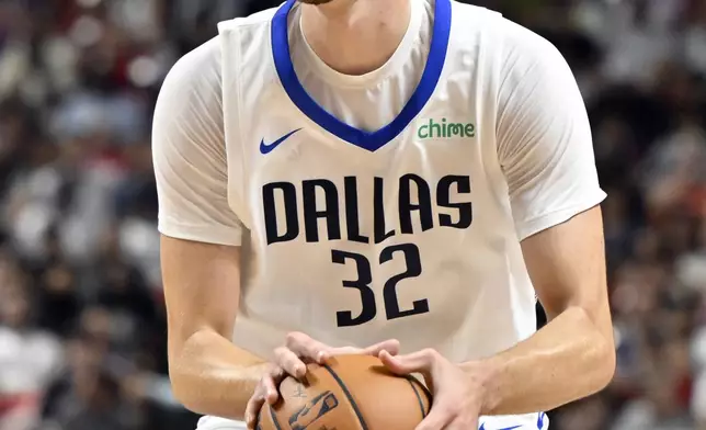 Dallas Mavericks forward Cooper Flagg (32) looks to shoot against the Los Angeles Lakers during the second half of an NBA summer league basketball game Thursday, July 10, 2025, in Las Vegas. (AP Photo/David Becker)