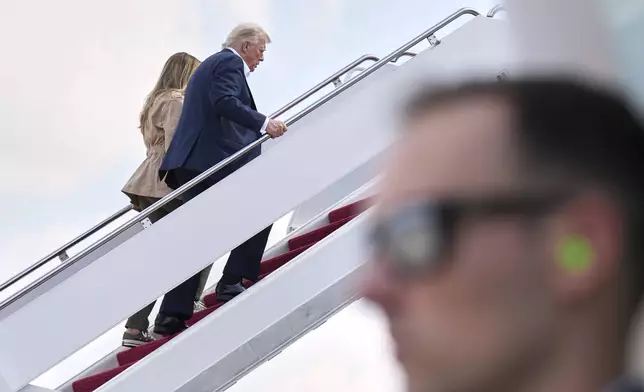 President Donald Trump and first lady Melania Trump, board Air Force One, Friday, July 11, 2025, at Joint Base Andrews, Md., en route to Texas. (AP Photo/Jacquelyn Martin)