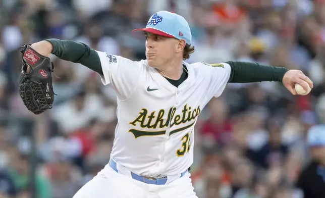 Athletics pitcher JP Sears throw to the San Francisco Giants during the second inning of a baseball game Friday, July 4, 2025, in West Sacramento, Calif. (AP Photo/Sara Nevis)
