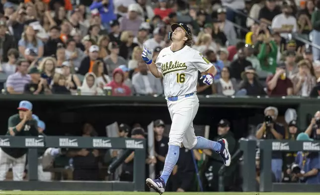 Athletics' Nick Kurtz points to the sky while running the bases after hitting a two-run home run during the sixth inning of a baseball game against the San Francisco Giants, Friday, July 4, 2025, in West Sacramento, Calif. (AP Photo/Sara Nevis)