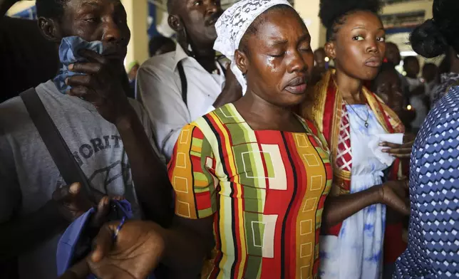 Pilgrims attend a Mass celebrating the Feast of Our Lady of Mount Carmel at the namesake church in the Pétion-Ville neighborhood of Port-au-Prince, Haiti, on Wednesday, July 16, 2025. (AP Photo/Odelyn Joseph)