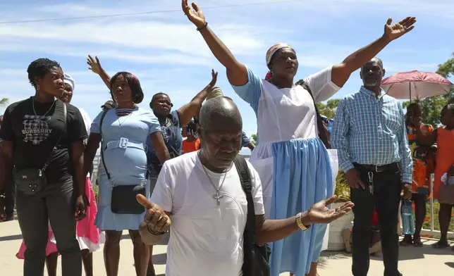 Pilgrims attend a Mass celebrating the Feast of Our Lady of Mount Carmel at the namesake church in the Pétion-Ville neighborhood of Port-au-Prince, Haiti, on Wednesday, July 16, 2025. (AP Photo/Odelyn Joseph)
