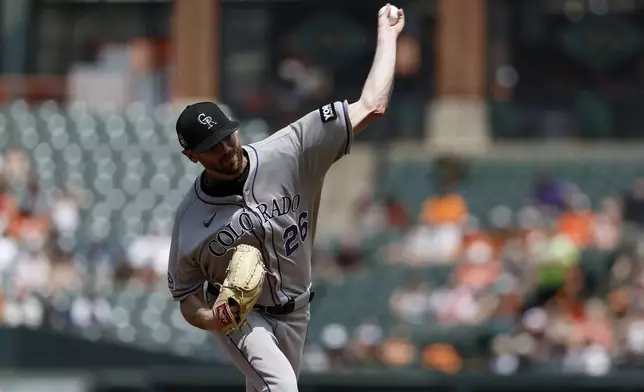 Colorado Rockies pitcher Austin Gomber throws during the first inning of a baseball game against the Baltimore Orioles in Baltimore, Sunday, July 27, 2025. (AP Photo/Terrance Williams)