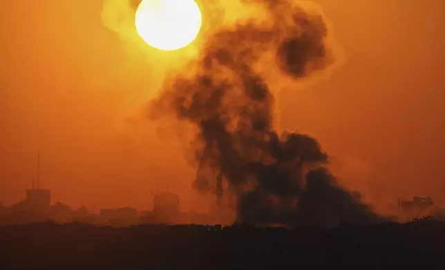 Smoke billows from an explosion in the northern Gaza Strip, as seen from southern Israel Wednesday, July 23, 2025. (AP Photo/Ohad Zwigenberg)