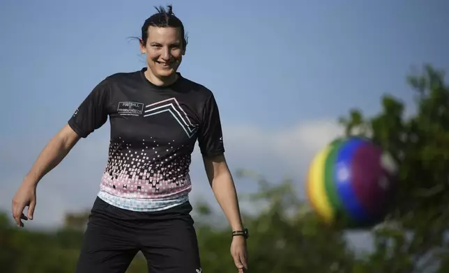 Transgender soccer player Natalie Washington, who leads the group "Football v Transphobia", takes part in a casual kickaround with some friends in Guildford, England, Thursday, May 8, 2025. (AP Photo/Alastair Grant)