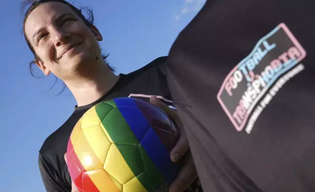 Transgender soccer player Natalie Washington, who leads the group "Football v Transphobia", takes part in a casual kickaround with some friends in Guildford, England, Thursday, May 8, 2025. (AP Photo/Alastair Grant)