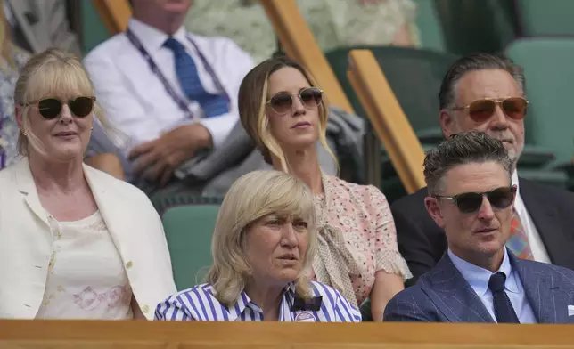 Actor Sarah Lancashire, Deborah Jevans, Britney Theriot, golfer Justin Rose and actor Russell Crowe, from left, sit in the Royal Box on Centre Court on day two at the Wimbledon Tennis Championships in London, Tuesday, July 1, 2025. (AP Photo/Kin Cheung)