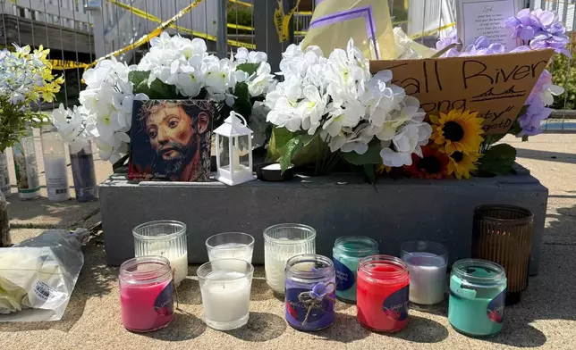 Flowers sit at a makeshift memorial in front of the Gabriel House assisted living facility, where a fire on Sunday killed several people, Wednesday, July 16, 2025 in Fall River, Mass. (AP Photo/Rodrique Ngowi)