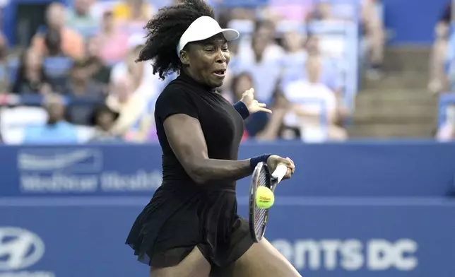 Venus Williams returns the ball against Peyton Stearns during a match at the Citi Open tennis tournament Tuesday, July 22, 2025, in Washington. (AP Photo/Nick Wass)