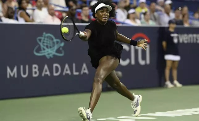 Venus Williams returns the ball against Peyton Stearns during a match at the Citi Open tennis tournament Tuesday, July 22, 2025, in Washington. (AP Photo/Nick Wass)