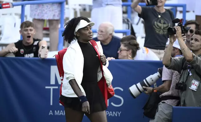 Venus Williams walks on the court before a match against Peyton Stearns at the Citi Open tennis tournament Tuesday, July 22, 2025, in Washington. (AP Photo/Nick Wass)
