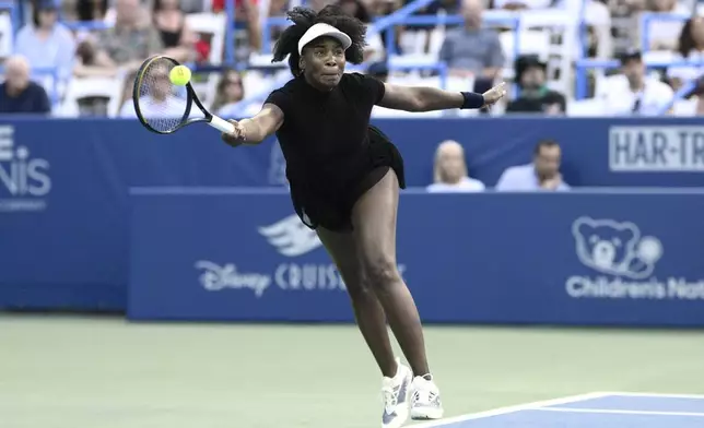 Venus Williams returns the ball against Peyton Stearns during a match at the Citi Open tennis tournament Tuesday, July 22, 2025, in Washington. (AP Photo/Nick Wass)