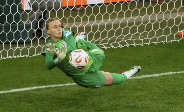 England goalkeeper Hannah Hampton makes a save during a penalty shootout in the Women's Euro 2025 final soccer match between England and Spain at St. Jakob-Park in Basel, Switzerland, Sunday, July 27, 2025. (AP Photo/Michael Probst)