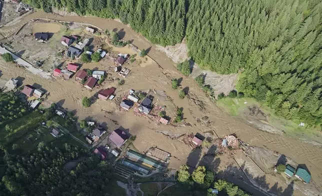 In this image released by the Romanian Emergency Services Suceava (ISU Suceava) damage from a flood is seen in the village of Brosteni, northern Romania, Monday, July 28, 2025. (Romanian Emergency Services - ISU Suceava via AP)