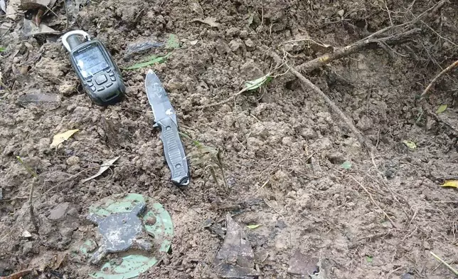In this Sunday, July, 2025, photo released by the Royal Thai Army, Thai soldiers inspect a border area in Ubon Ratchathani†province where the Royal Thai Army said two anti-personnel landmines were found. (Royal Thai Army via AP)