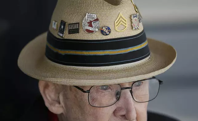 FILE - In this photo taken April 29, 2019, D-Day veteran Jake Larson watches as the "The Spirit of Benovia" WWII-era aircraft lands in Oakland, Calif. (AP Photo/Eric Risberg, file)