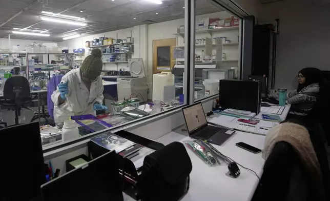 A laboratory technician Nozipho Mlotshwa works on samples at the Wits laboratory Antiviral Gene Therapy Research Unit, at University of the Witwatersrand Medical School, in Johannesburg, South Africa, Thursday, May 22, 2025. (AP Photo/Themba Hadebe)
