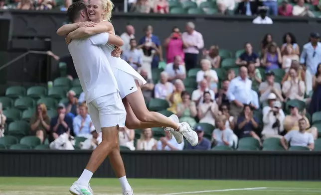 Sem Verbeek of the Netherlands and Katerina Siniakova of Czech Republic celebrate winning the mixed doubles final match against Joe Salisbury of Britain and Luisa Stefani of Brazil at the Wimbledon Tennis Championships in London, Thursday, July 10, 2025. (AP Photo/Kirsty Wigglesworth)