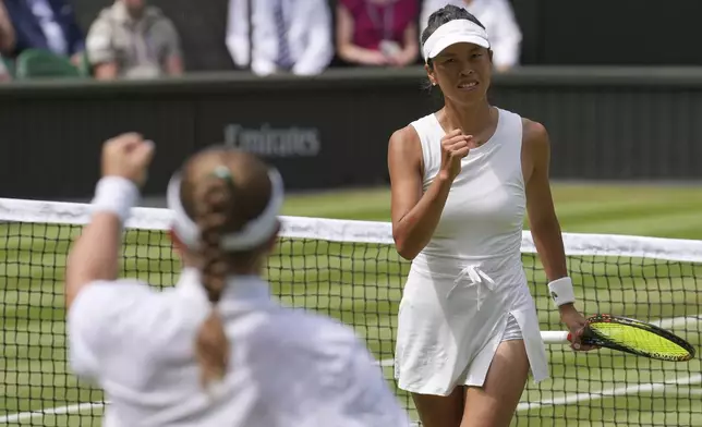 Su-Wei Hsieh of Taiwan, right, and Latvia's Jelena Ostapenko Veronika Kudermetova react after clinching the first set against Elise Mertens of Belgium during the women's doubles final at the Wimbledon Tennis Championships in London, Sunday, July 13, 2025. (AP Photo/Kin Cheung)