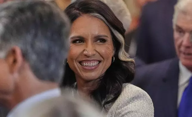 Director of National Intelligence Tulsi Gabbard arrives before President Donald Trump speaks during a reception for Republican members of Congress in the East Room of the White House, Tuesday, July 22, 2025, in Washington. (AP Photo/Julia Demaree Nikhinson)