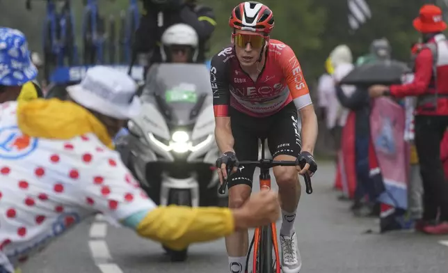 Stage winner Netherlands' Thymen Arensman climbs during the fourteenth stage of the Tour de France cycling race over 182.6 kilometers (113.5 miles) with start in Pau and finish in Luchon Superbagneres, France, Saturday, July 19, 2025. (AP Photo/Thibault Camus)