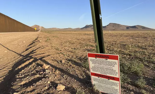 A sign warns against unauthorized entry into a militarized zone along the southern U.S. border in New Mexico on June 12, 2025. (AP Photo/Morgan Lee)