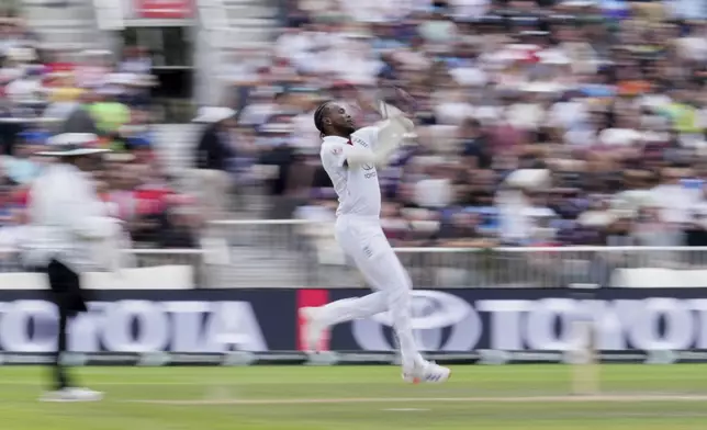 England's Jofra Archer bowls a delivery on the fourth day of the fourth cricket test match between England and India at Emirates Old Trafford, Manchester, England, July 26, 2025.(AP Photo/Jon Super)