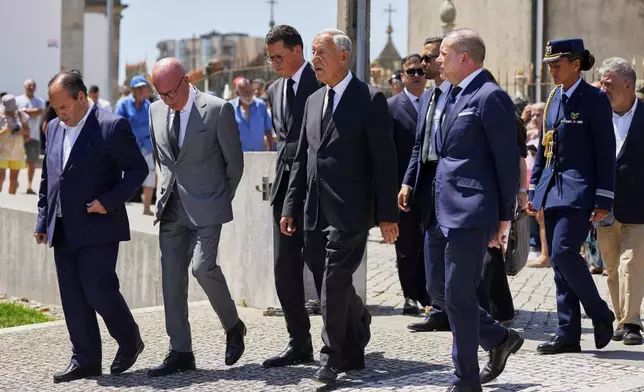 President of Portugal Marcelo Rebelo de Sousa, center, arrives at a church where the bodies of Liverpool forward Diogo Jota and André Silva have been brought for a wake and funeral, in Gondomar, near Porto, Portugal, on Friday, July 4, 2025. (AP Photo/Manu Fernandez)