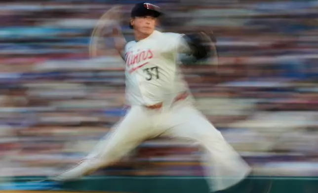 Minnesota Twins relief pitcher Louis Varland (37) delivers during the eighth inning of a baseball game against the Chicago Cubs, Wednesday, July 9, 2025, in Minneapolis. (AP Photo/Abbie Parr)