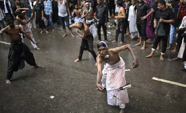 Shiite Muslims participate in an Ashoura commemoration marking the 7th-century death of Imam Hussein, the grandson of the Prophet Muhammad, in Dhaka, Bangladesh, Sunday, July 6, 2025. (AP Photo/Mahmud Hossain Opu)