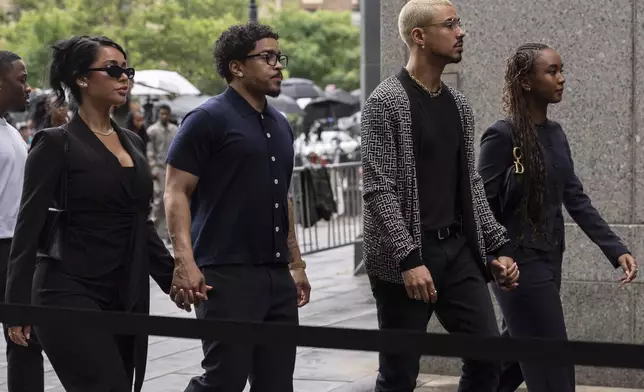 Chance Combs, right, Quincy Brown, second right, and Justin Dior, second left, daughter and son of Sean "Diddy" Combs, arrive at court on Wednesday, July 2, 2025, in New York. (AP Photo/Yuki Iwamura)