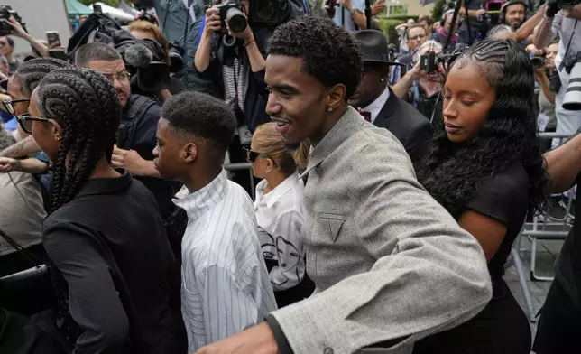 Family members of Sean "Diddy" Combs, react as they leave Manhattan federal court after Combs' was convicted of a prostitution-related offense but acquitted on the most serious charges at his New York trial, Wednesday, July 2, 2025, in New York. (AP Photo/Yuki Iwamura)